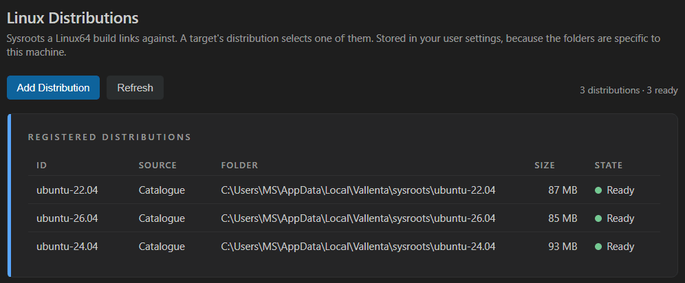 Vallenta Studio Linux Distributions panel listing three registered sysroots, ubuntu-22.04, ubuntu-24.04 and ubuntu-26.04, each from the catalogue with its folder, size and Ready state.